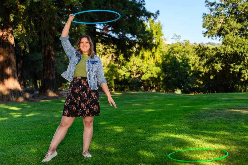 woman holding up a hula hoop