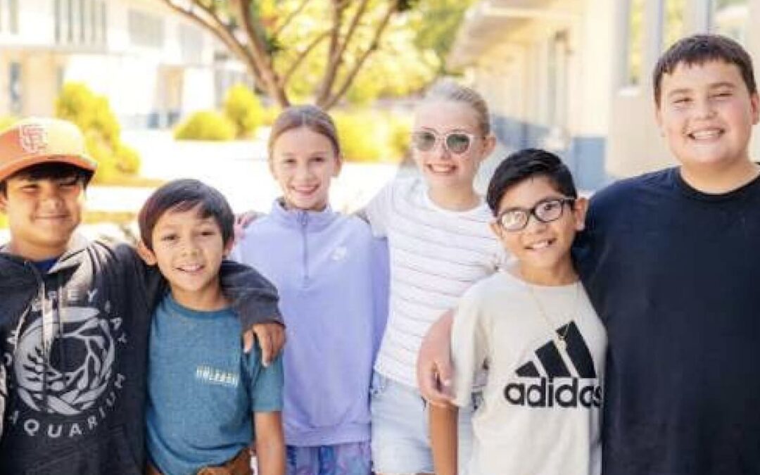 teens hugging each other outside in Napa Valley