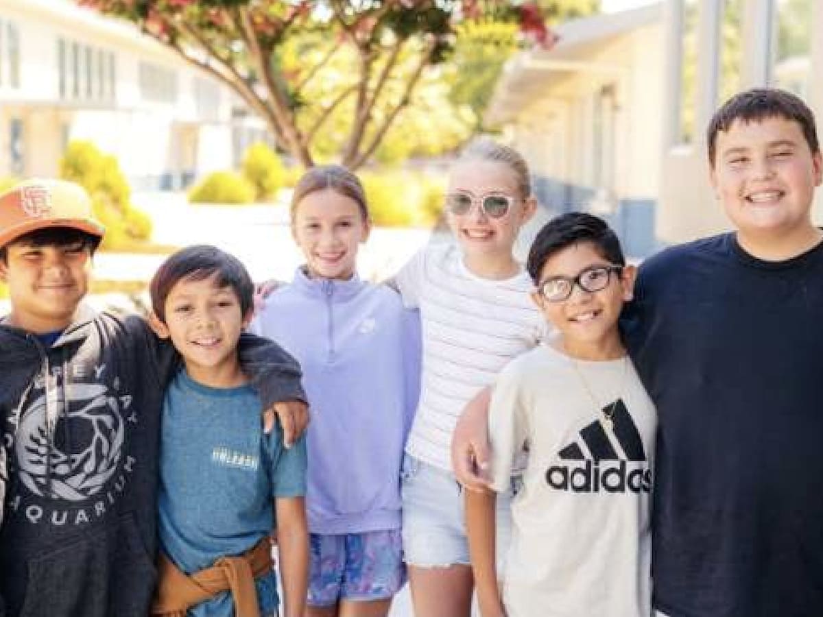 teens hugging each other outside in Napa Valley